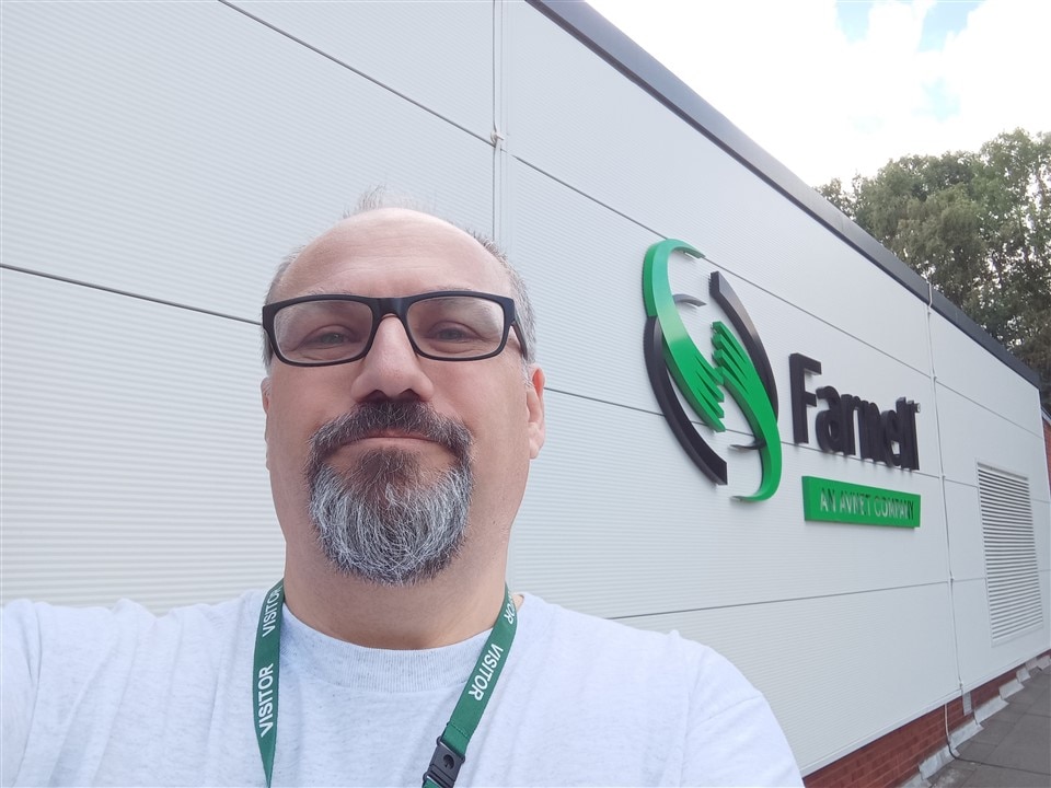 Andy from Workshopshed standing in front of a white building with an AVNet and Farnell Logo