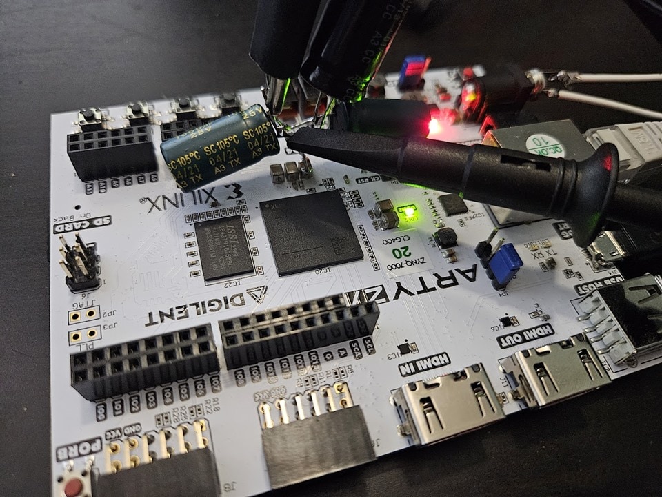 A few electrolytic capacitors soldered to the board