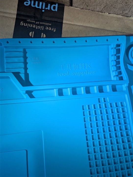 Silicone soldering mat close-up with raised tactile labels