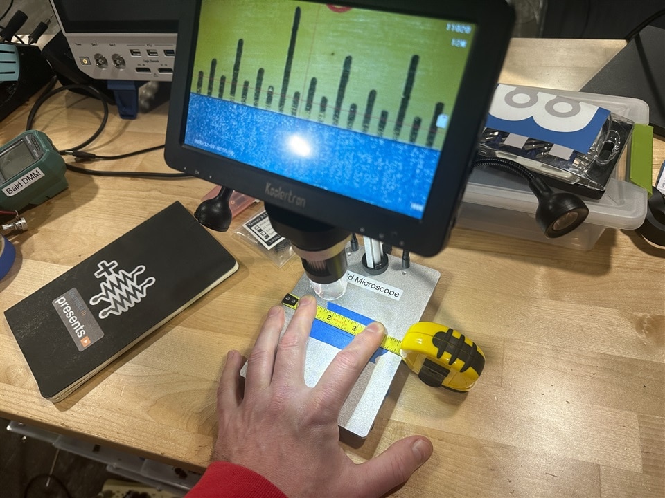 wide shot of microscope and tape measure